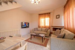 TV a/nebo společenská místnost v ubytování hespéra Summer House