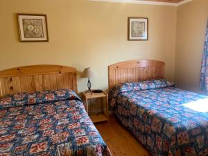 Postel nebo postele na pokoji v ubytování Brudenell Fairway Chalets + 23 fotografií
