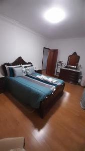 Ένα ή περισσότερα κρεβάτια σε δωμάτιο στο Casa da Magnólia