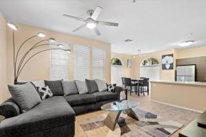 a living room with a couch and a table at Lovely & coxy 2BR/2BA! 5MIN to Disney! in Anaheim
