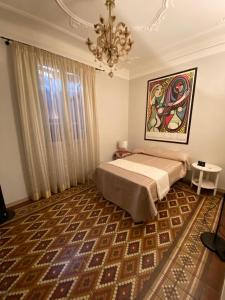 Giường trong phòng chung tại casa contessa rinaldi