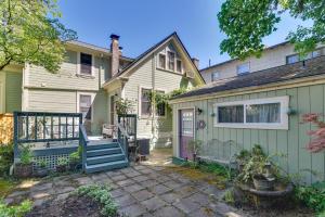 a house with a gate and a patio at Cozy Portland Studio with Patio and Yard! in Portland