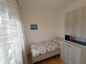 Postel nebo postele na pokoji v ubytování Apartman Šimun