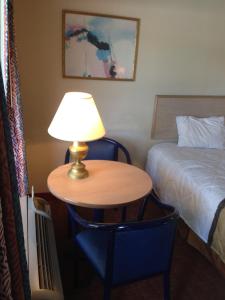 a bed room with a lamp and a lamp post at Sky Suites in Tybee Island