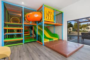 a play room with a slide and a play structure at BIG4 Tasman Holiday Parks - Bendigo in Bendigo +202 photos