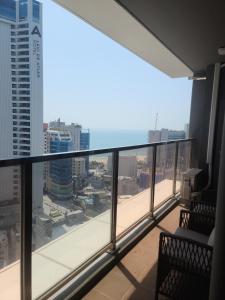 a balcony with a view of a city at Elbon The Stay in Busan