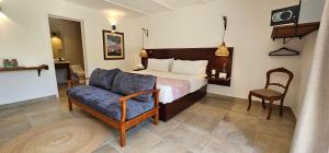 Rúm í herbergi á Plaza Chapala Hotel