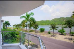 a room with a view of a river and palm trees at Promotion summer vacation, Ocean Villa Nha Trang 600m2 with 7 Bedrooms, Karaoke, BBQ in Nha Trang