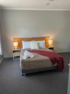 Säng eller sängar i ett rum på Lismore Fair Dinkum Motel