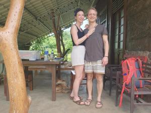 Ceylon Resort Wilpattu في ويلباتو: a man and a woman staying for a picture