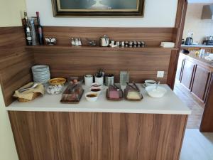 a counter with food items on it in a kitchen at Vontzos Hotel in Achladies