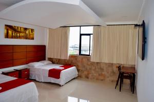 Postel nebo postele na pokoji v ubytování Hotel Apart Guayaquil Aeropuerto
