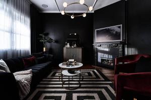 a living room with a couch and a table at Ruby by Whiskey June in Maryborough