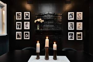 a dining room with two candles on a table at Ruby by Whiskey June in Maryborough