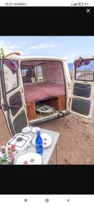 an old van with a table in front of it at canary van for drive, near to TFS Mercedes MB130 in Adeje