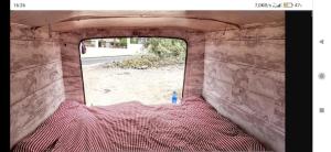 una vista desde el interior de una furgoneta con ventana en canary van for drive, near to TFS Mercedes MB130, en Adeje