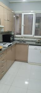 a kitchen with a stove and a counter top at Grand Bazaar Crossing apartment in Istanbul