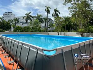 a swimming pool on the roof of a building at GeorgeTown 6BR KTV Bungalow 28Pax in George Town