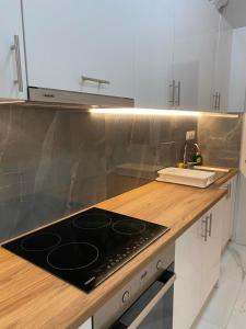 A cozinha ou cozinha compacta de Casa Costera 2 lux apt