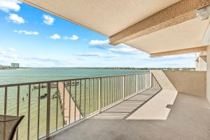 a balcony with a view of the water at Compass Point 303 in Gulf Shores