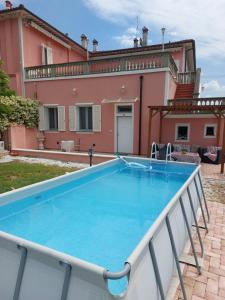 a pool in front of a house at Empoli Campagna, Appartamento Indipendente con giardino 500 mq e piscina privati in Empoli