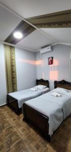 Postel nebo postele na pokoji v ubytování Guesthouse kalakala