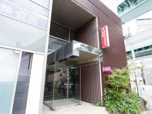 an external view of a building with a glass door at Reality Hakata 2 in Fukuoka