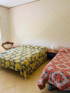 Postel nebo postele na pokoji v ubytování Casa vacanze MaMe’