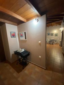 a room with a table and a room with a dining room at Country house in Galatas
