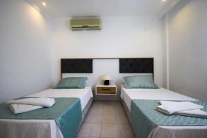 two twin beds in a room with at Villa MK in Kalkan