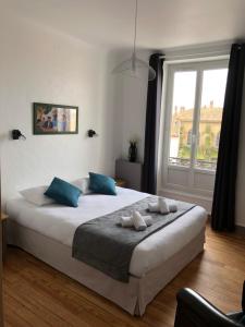 Un ou plusieurs lits dans un hébergement de l'établissement Hotel Cote Basque