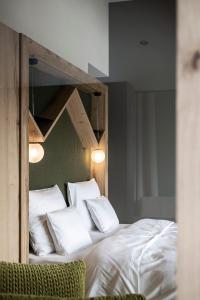 A bed or beds in a room at Aparthotel My Daum