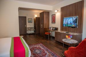TV a/nebo společenská místnost v ubytování La Oasis by Meraden ,Goa