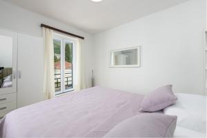 Ein Bett oder Betten in einem Zimmer der Unterkunft Apartment Iva