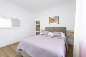 Ein Bett oder Betten in einem Zimmer der Unterkunft Apartment Iva