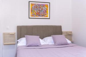 Ein Bett oder Betten in einem Zimmer der Unterkunft Apartment Iva