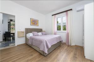 Ein Bett oder Betten in einem Zimmer der Unterkunft Apartment Iva