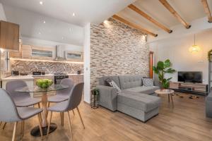 a living room with a couch and a table at Casa Bonita Afandou in Rhodes Town
