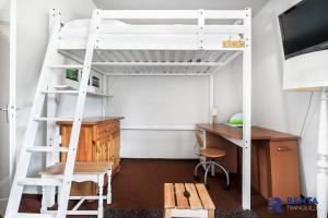 a bedroom with a desk and a bunk bed at Le Carlit - Cosy au calme proche centre - 5 min in Font-Romeu-Odeillo-Via