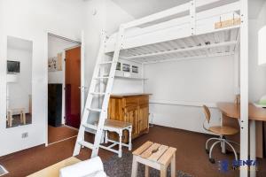 a room with a bunk bed and a desk and a ladder at Le Carlit - Cosy au calme proche centre - 5 min in Font-Romeu-Odeillo-Via