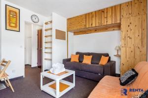 a living room with a couch and a loft bed at Le Capcir - Cosy et lumineux pour se ressourcer in Font-Romeu-Odeillo-Via