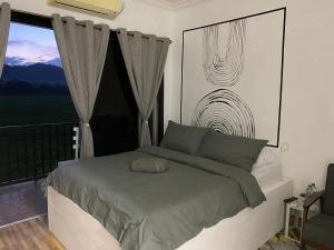 Letto o letti in una camera di LamanLeman Langkawi