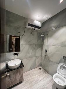 a bathroom with a sink and a toilet at Hotel Ventures Inn in Amritsar
