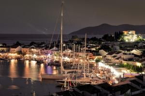 a group of boats docked in a marina at night at Stone Villa in Pythagoreio