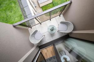 Balkón nebo terasa v ubytování Žalia kopa Metropolis Vilnius