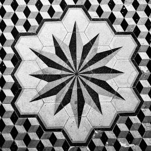 a black and white tile floor with a geometric design at Titan House Hostel in Izmir