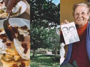 Casa Rural El Abuelo de Arcos - Only Adults في Meis: امرأة تمسك صورة شخصين وطبق من الطعام