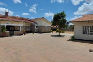 a brick driveway in front of a building at La petals hideaway house-Machakos in Machakos