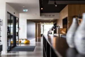 a kitchen with a sink and a counter top at Airport Hotel, Billund in Billund