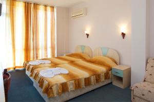 Postel nebo postele na pokoji v ubytování Hotel Arda